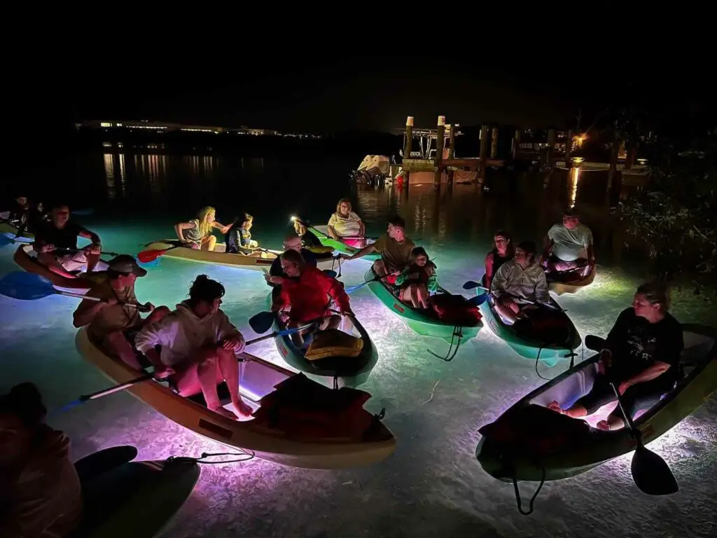 LED-illuminated kayak experience at night